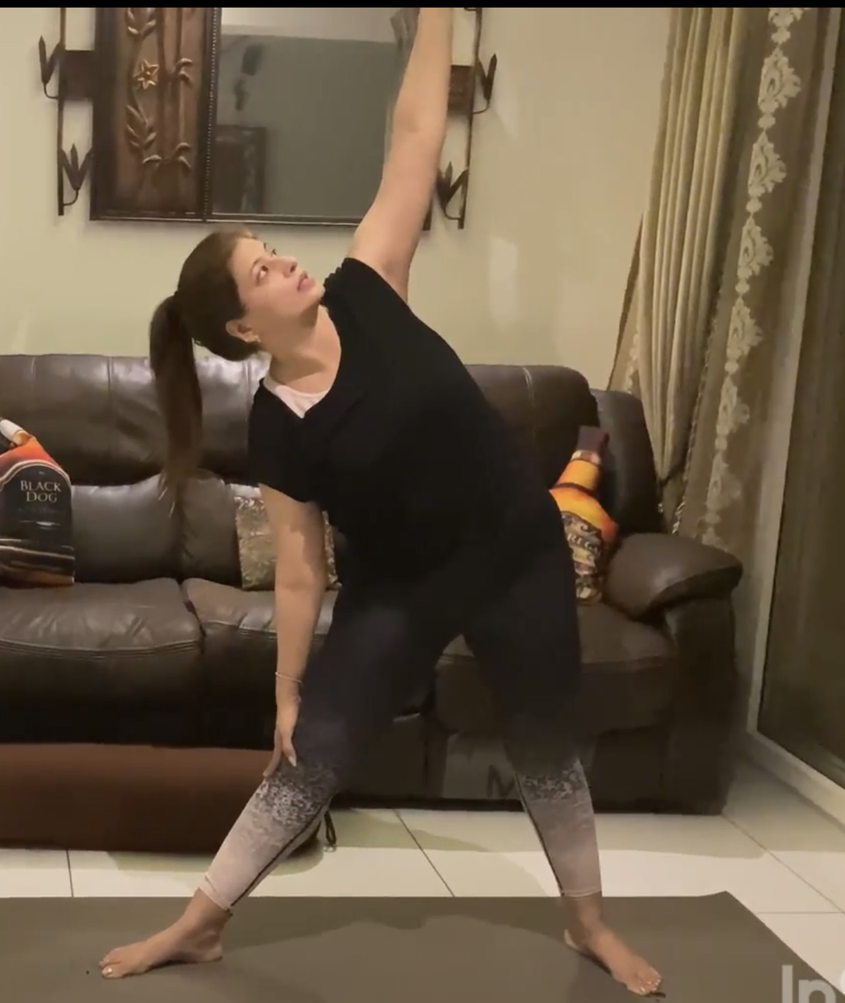 Diksha demonstrating an aligned standing triangle pose